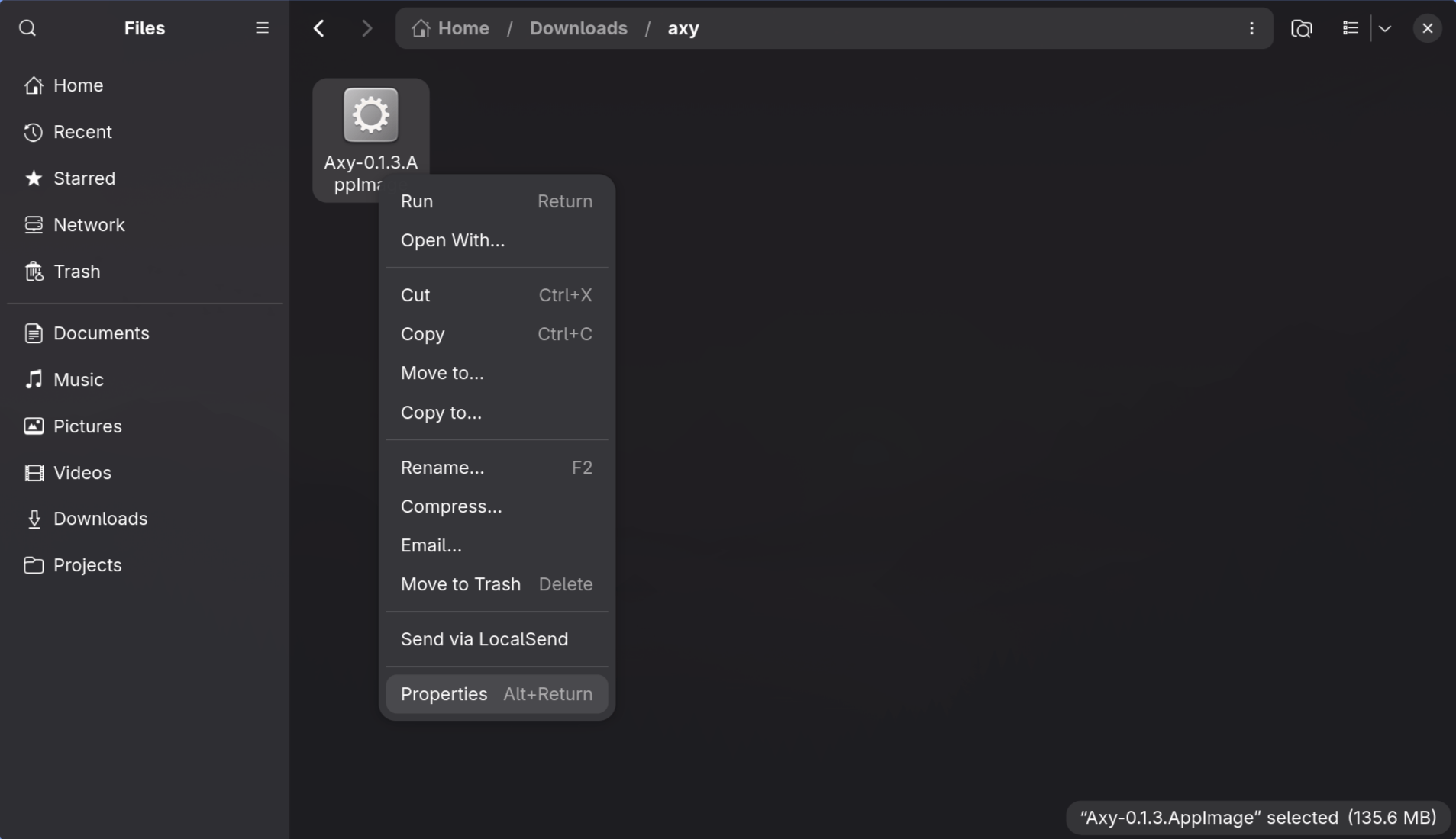 A Linux terminal running chmod +x on the AppImage, then launching Axy